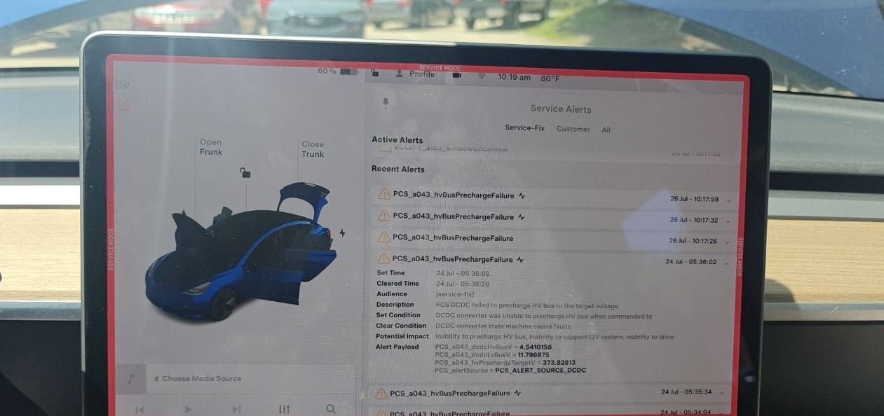 Tesla service mode alert detail for PCS_a043_hvBusPrechargeFailure showing hvBusV of 4.54 volts against an hvPrechargeTargetV of 373.83 volts